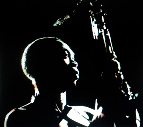 Fela Kuti with saxophone - interviewed and performing at Glastonbury in 1984 with Yinusa Akinnibosun on tenor sax, son Femi on alto and Tony Allen on drums